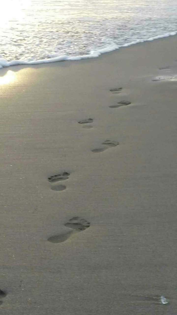 footsteps along the water