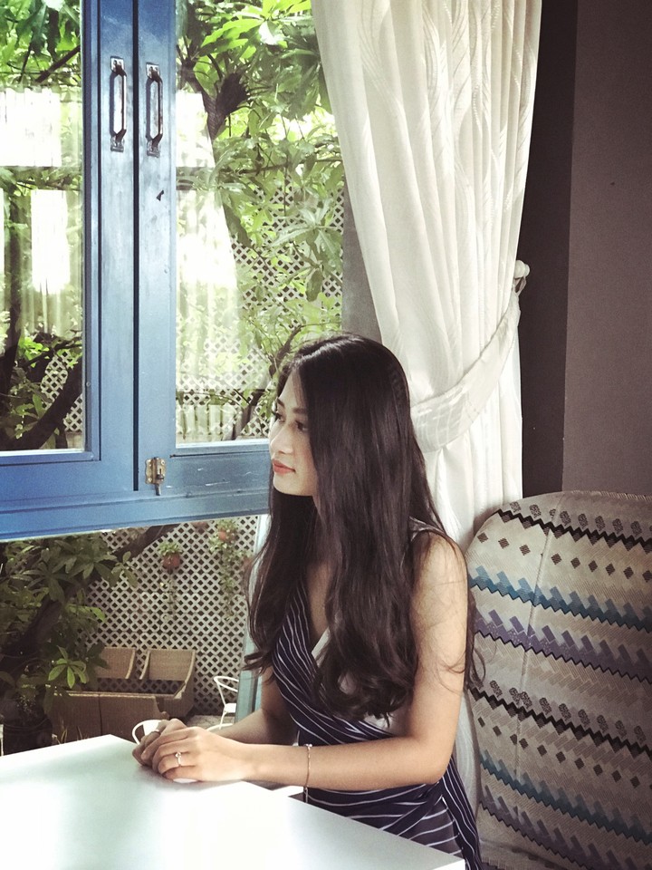 next to the window