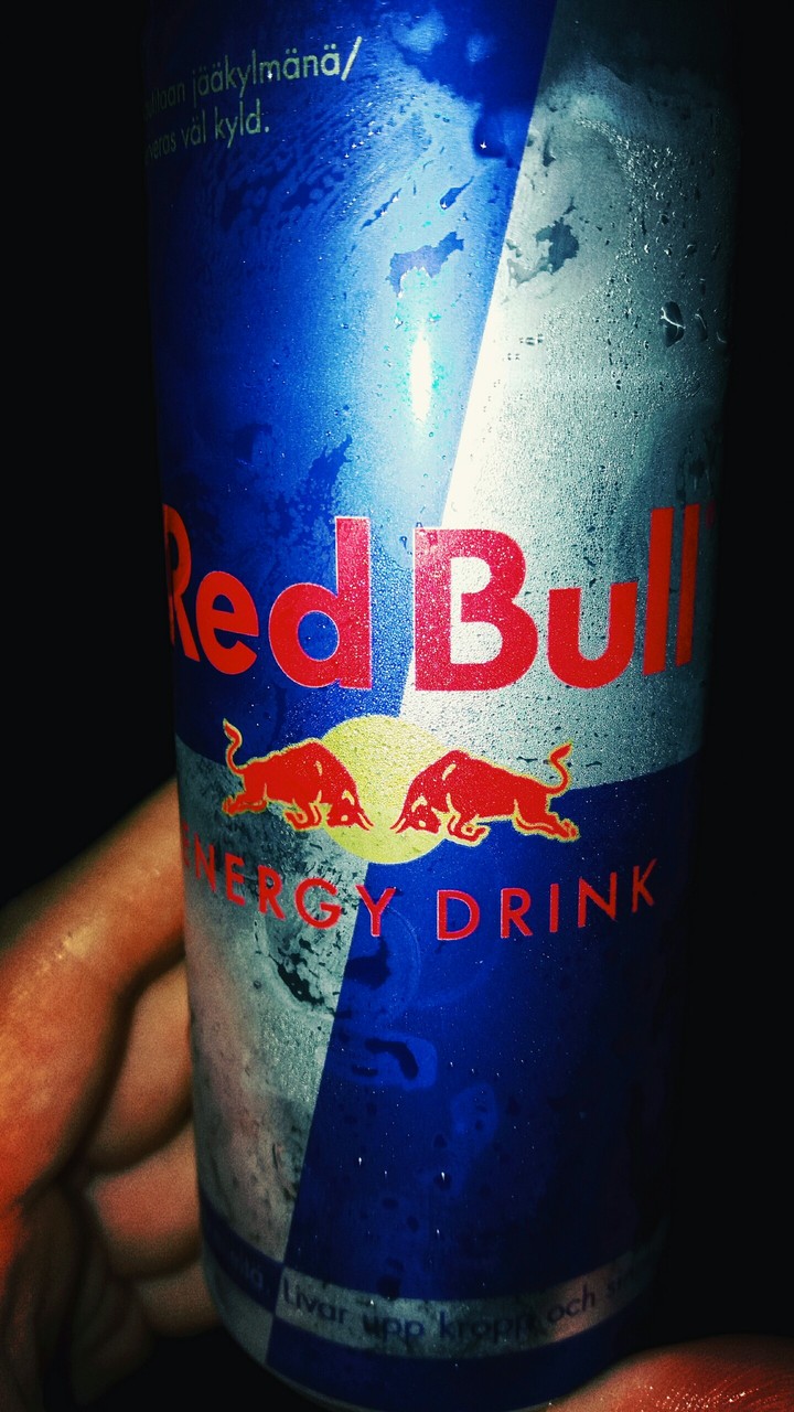 An Ice cold Red Bull In a hot summer day