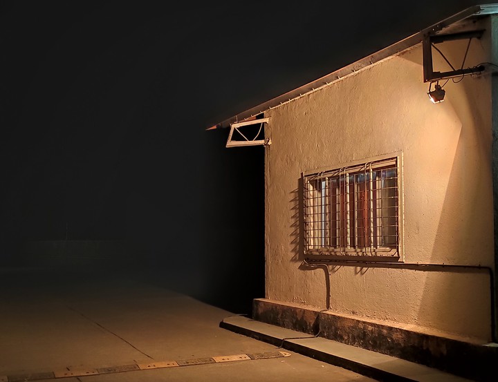 House marked by yellow light..