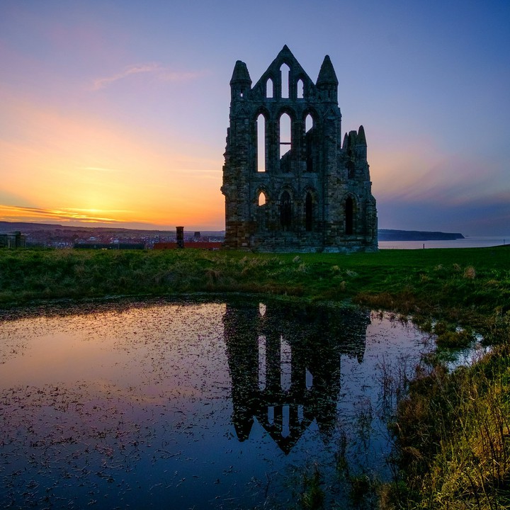 silhouetted abbey ruins