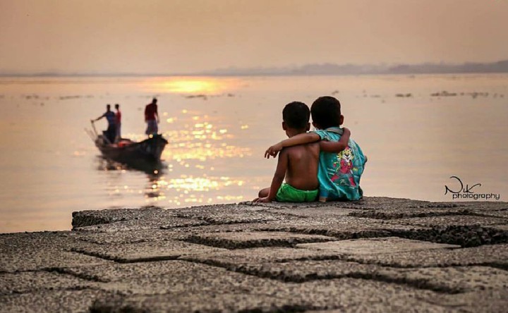 Two Child Friend Behind A River