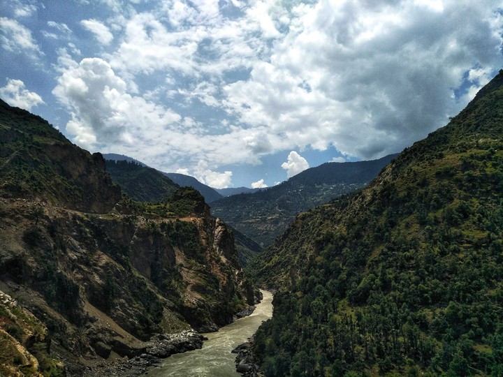 The river meanders through the mountains