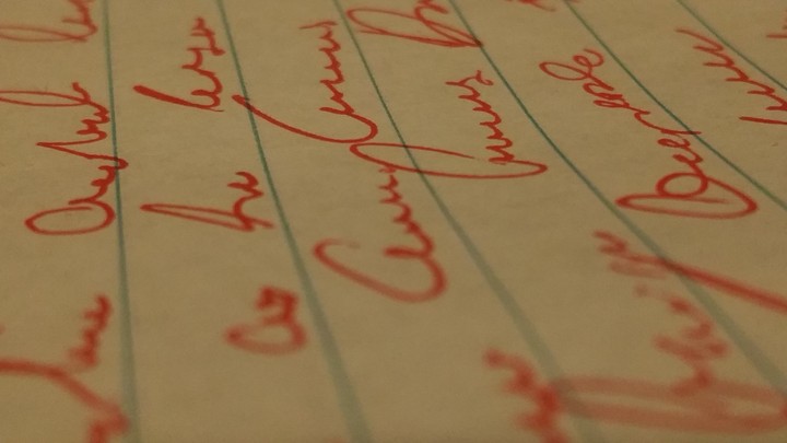 Cursive in red