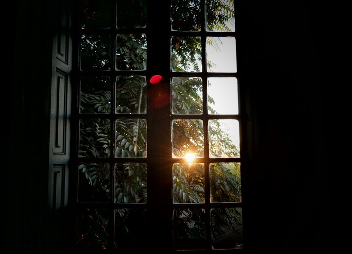 Sunset in an old window