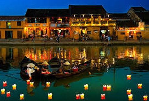 releasing candle-lit lanterns onto the river