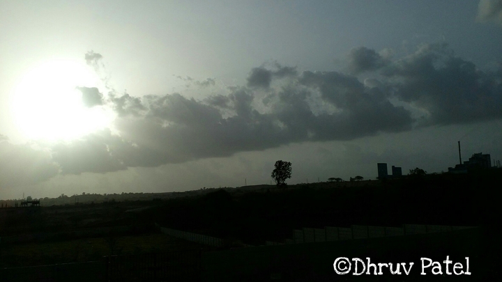 Sunset behind the clouds