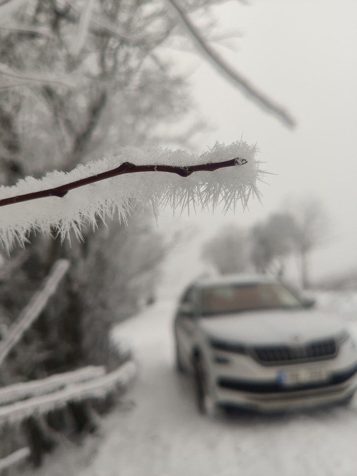 car on snow road