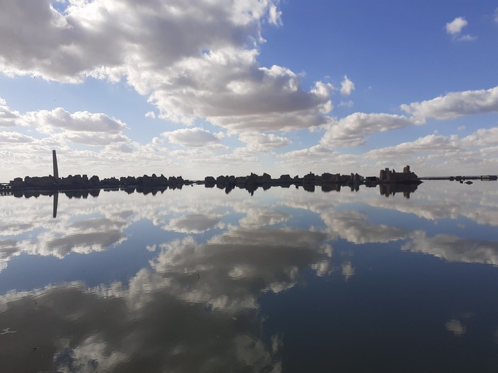 beach reflection clouds