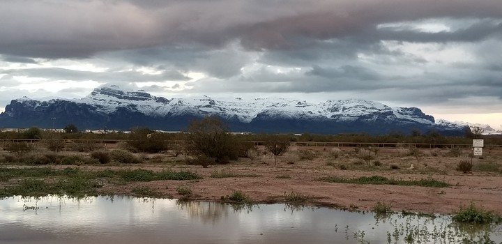 The snowcapped Superstition Mountains