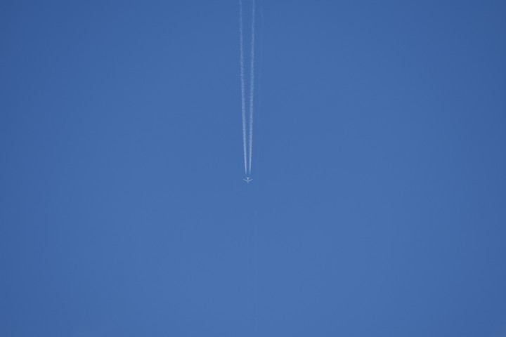 Clear blue sky and airplane