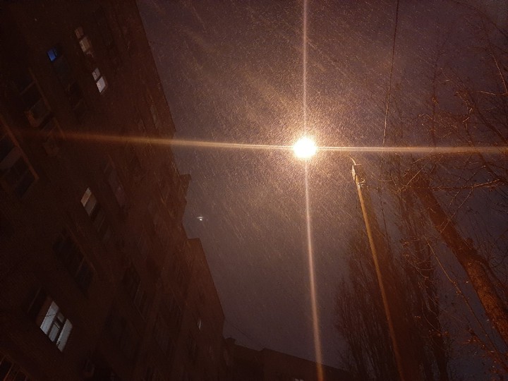 Light of the street lamp like a cross
