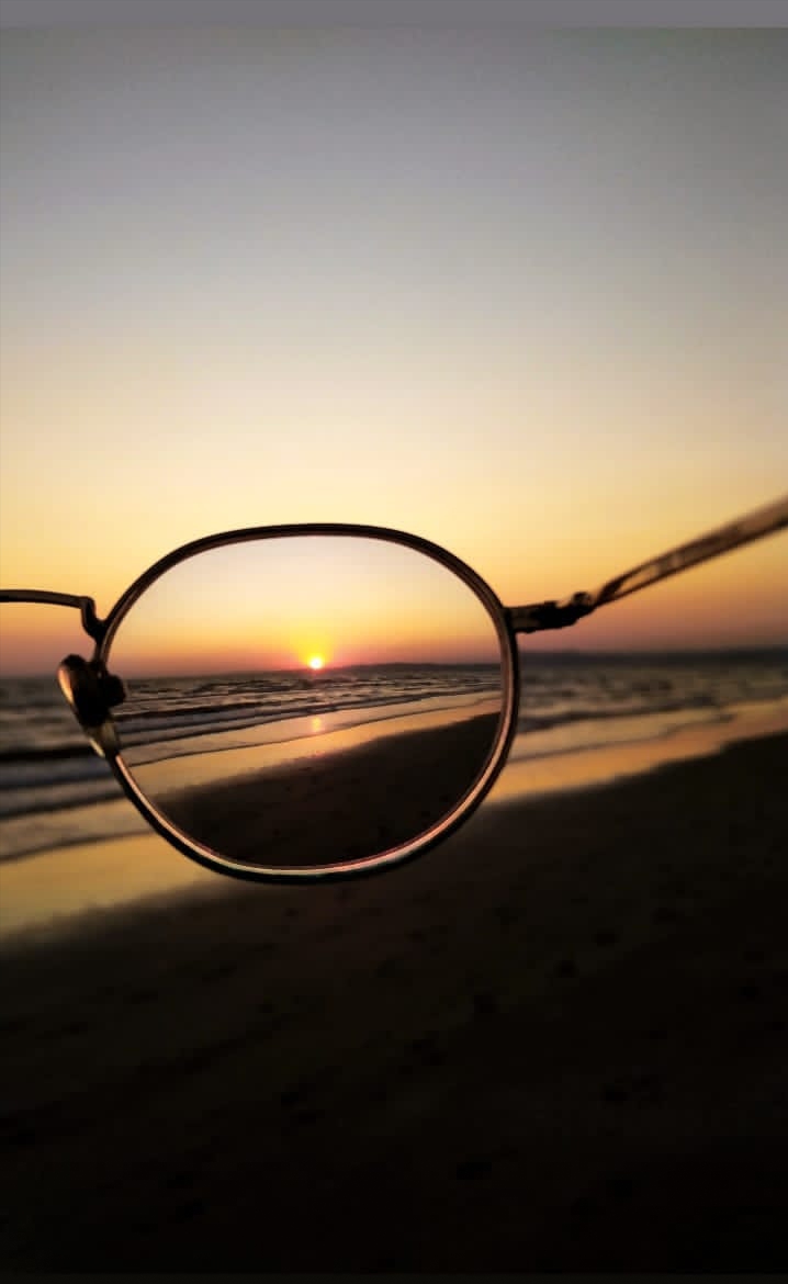 glasses behind sun