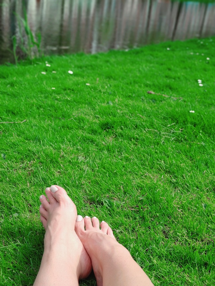 feet in grass