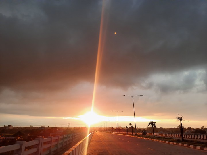 Sun Setting beyond Dark Clouds