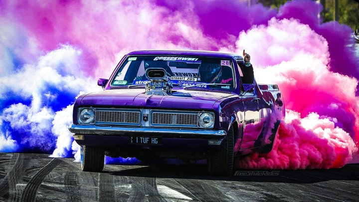 A Holden doing a coloured burnout