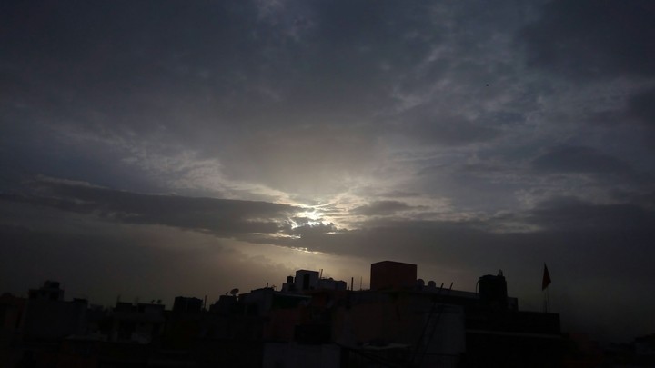 Sun behind a cloud.