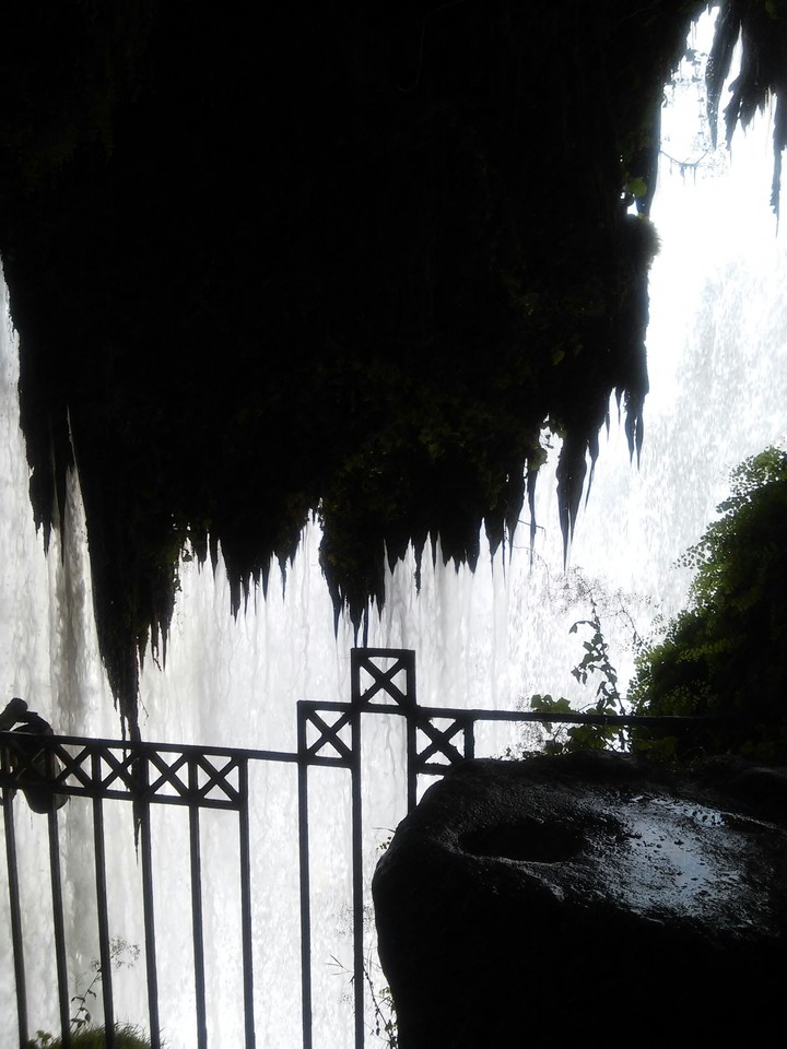 under the waterfall