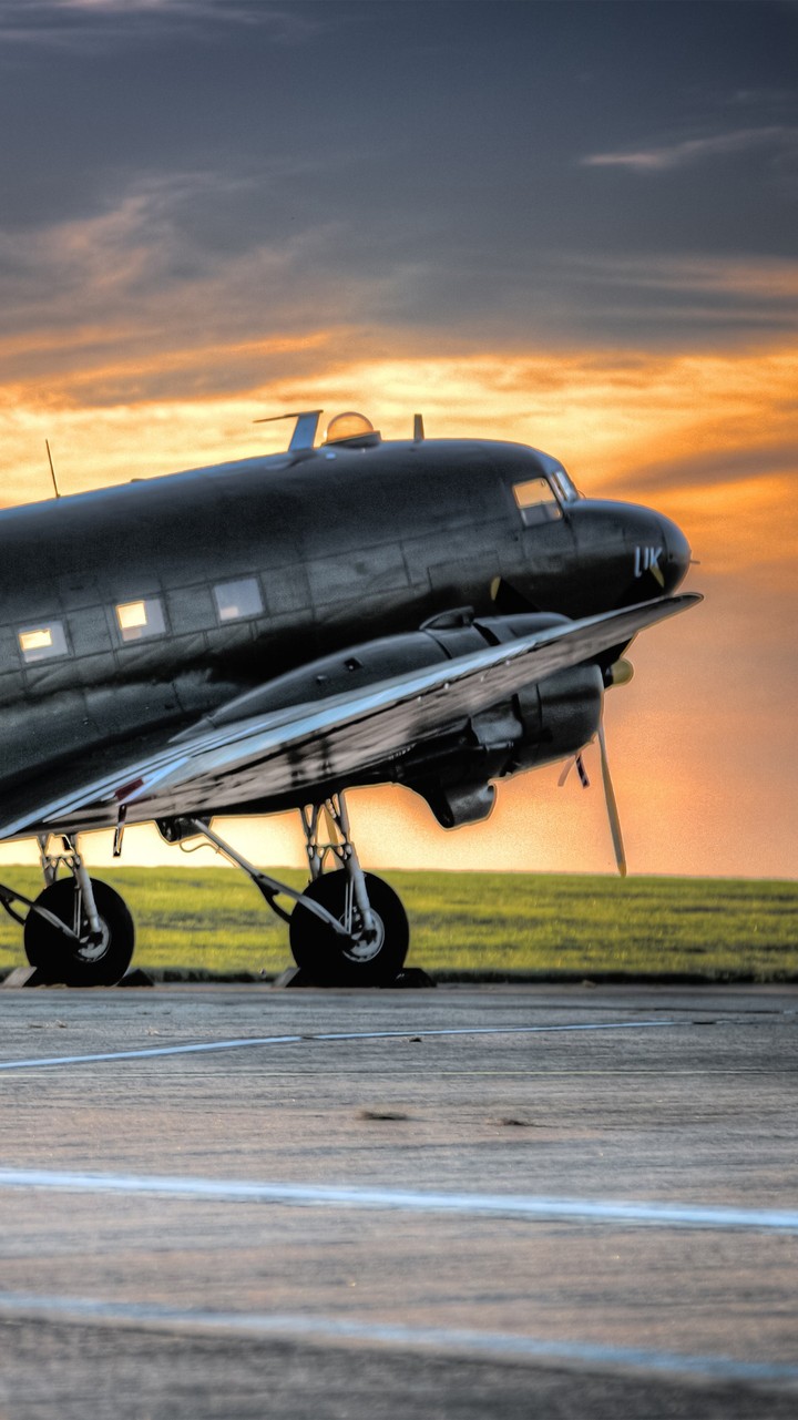 Grey Airplane in the Sunrise