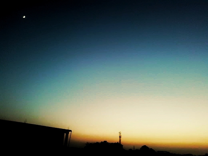 Evening moon and sunset