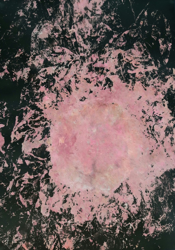 Light pink blot in the darkness