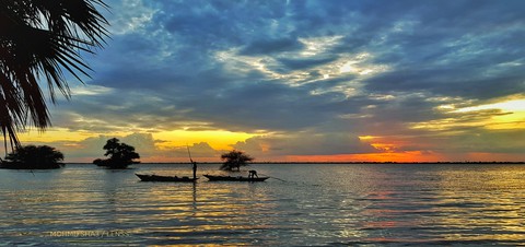 sunset on Nile and the Fisher