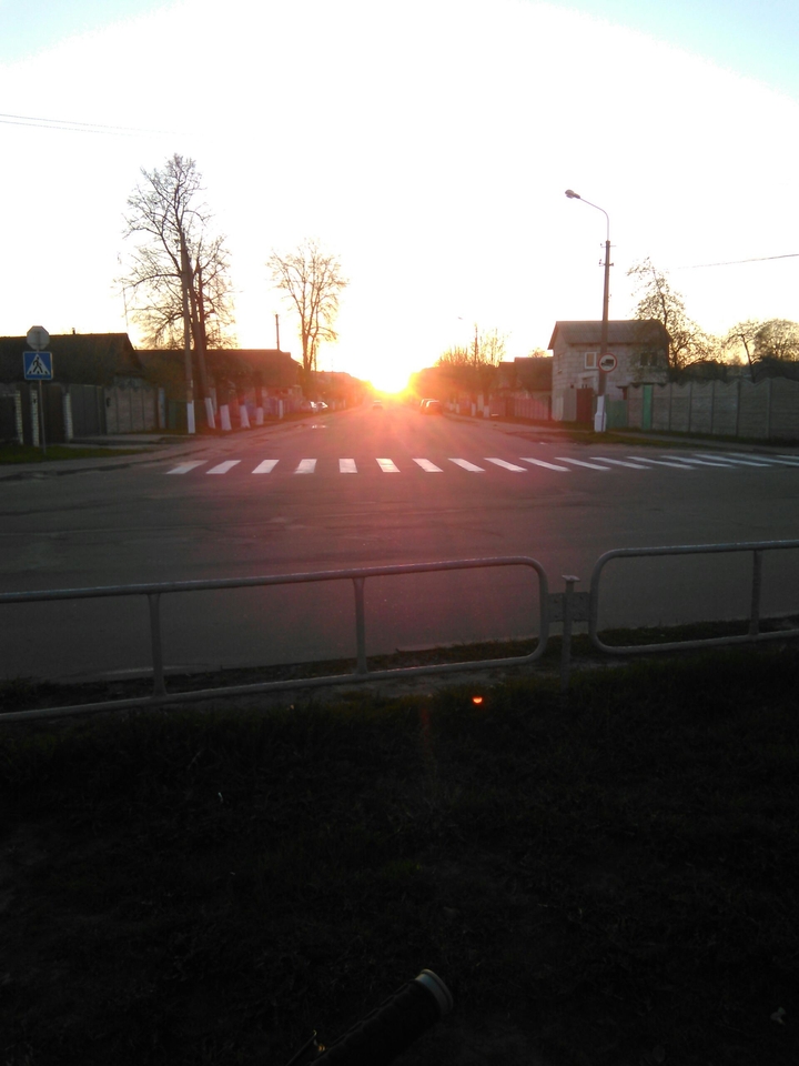 sunset at the end of the road
