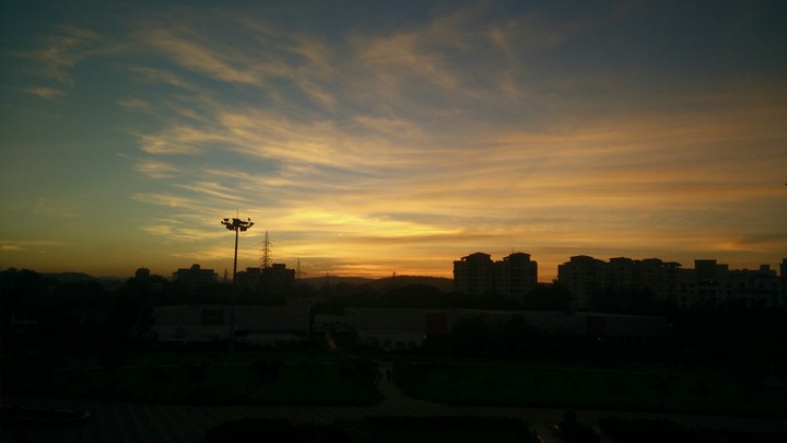 Sunset,  cotton expanse across the sky