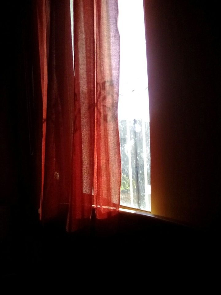 A window with a sun
