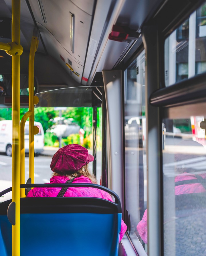 women sitting alone inside the bus