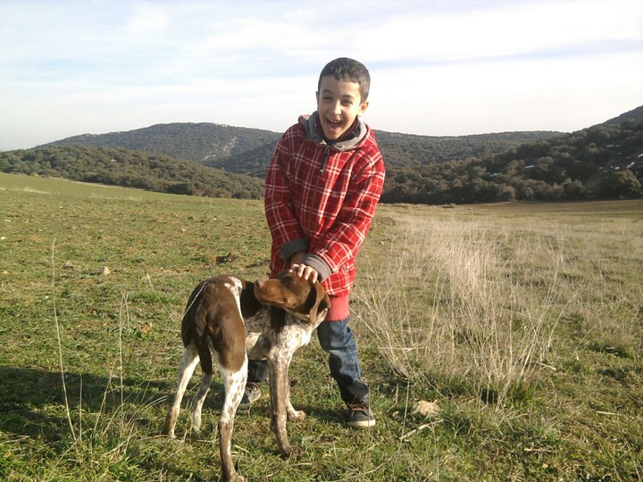 boy with dog in the farm