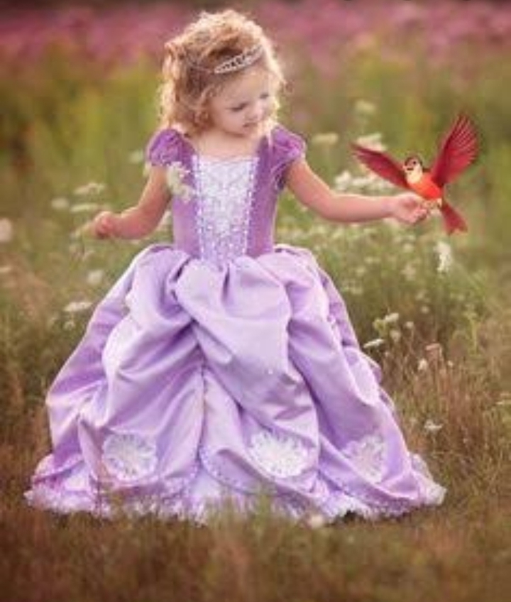 a girl with a beautiful bird