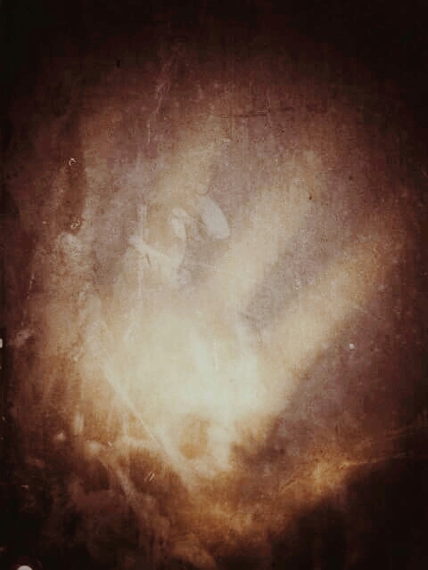 Cripi hand behind the dirty window