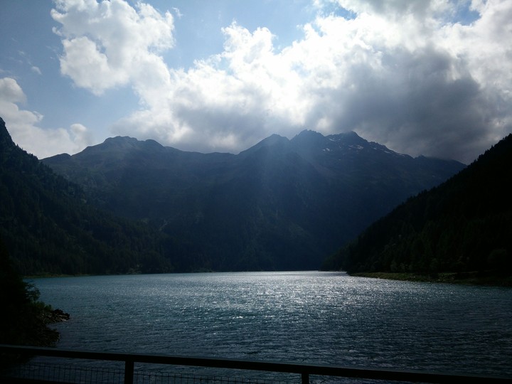 sunshine through clouds on lake