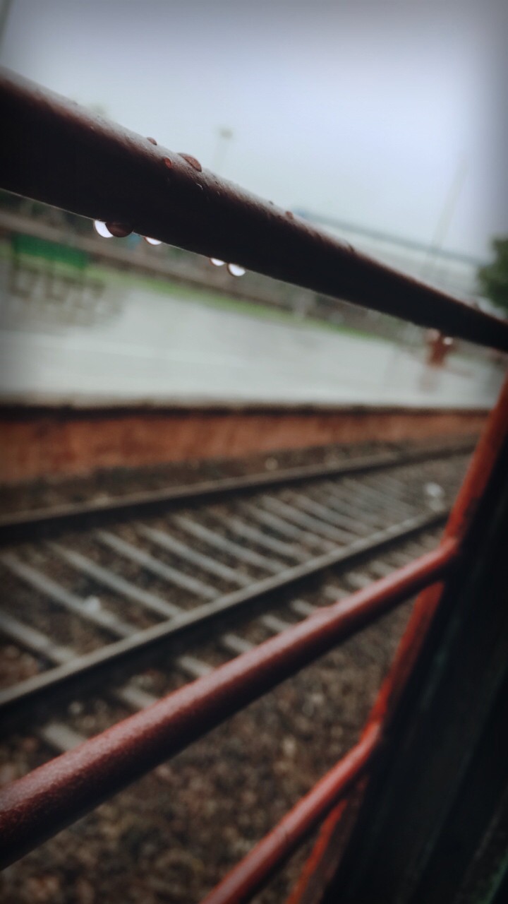 Rain drop on train's window bar