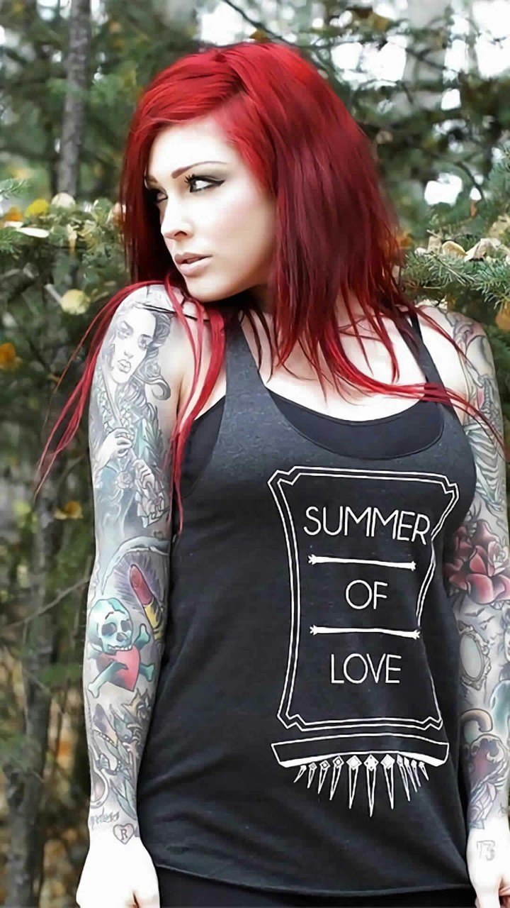 Red hair girl with tattoo ..