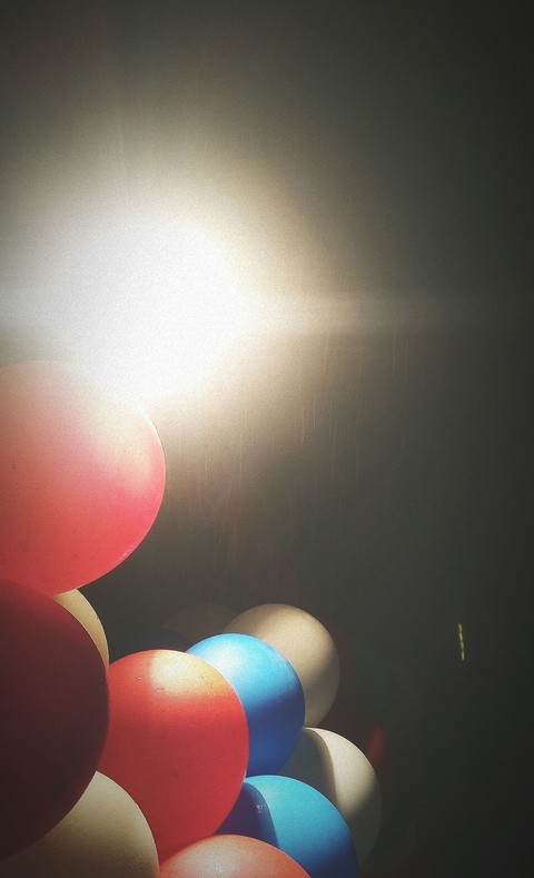Balloons in drizzle.