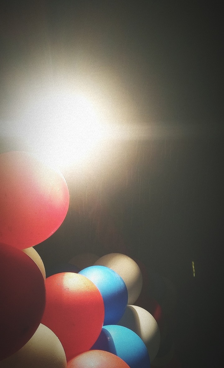 Balloons in drizzle.