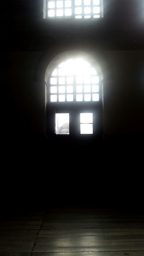The window of Haghia Sophia opening to the Blue Mosque