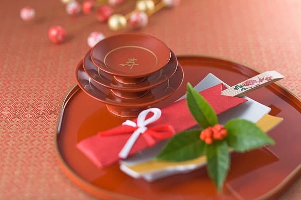 sake saucers and chopsticks on lacquer tray