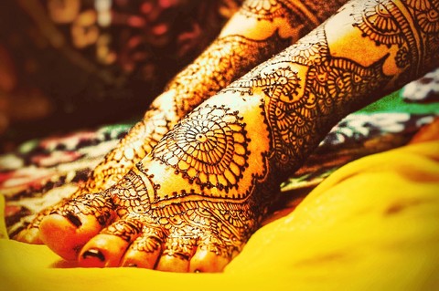 Getting ready and applying mehndi to become a bride