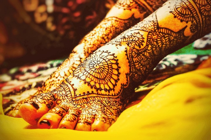 Getting ready and applying mehndi to become a bride