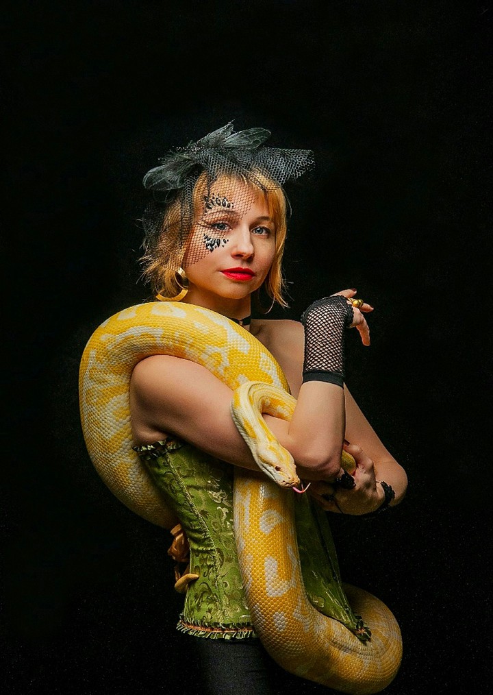 Playing with Her Snake