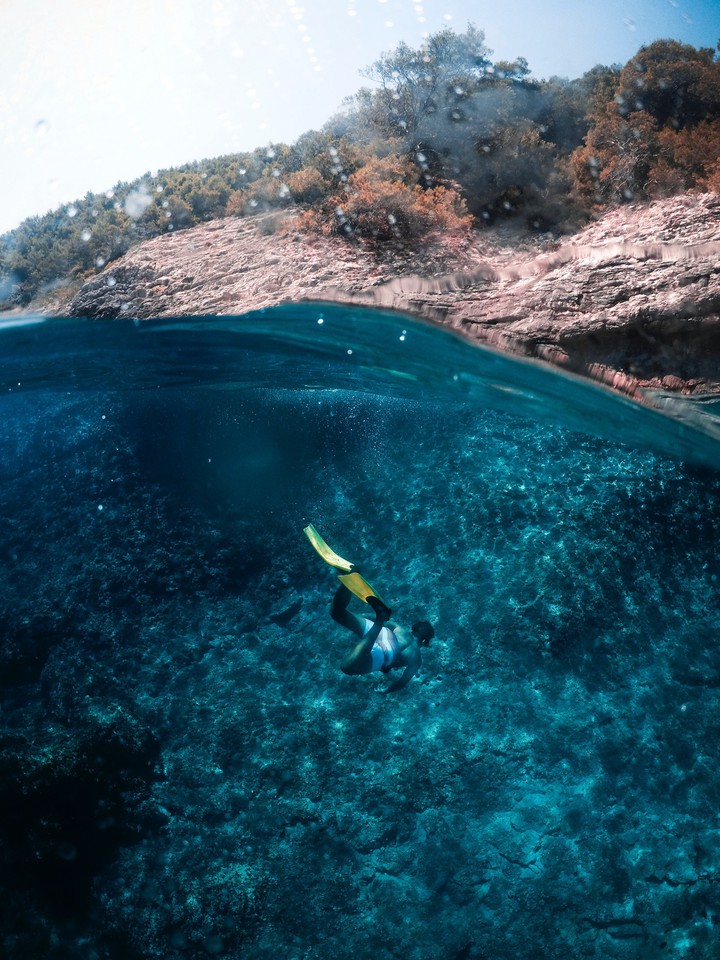 Person Diving Into The Ocean