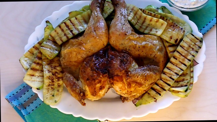Chicken on salt with grilled zucchini and tzatziki sauce