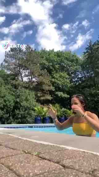 Lady jumping out of pool