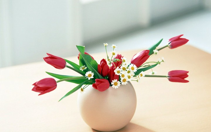 cute tulip bouquet in a round vase