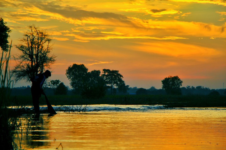 sunset with fisher man