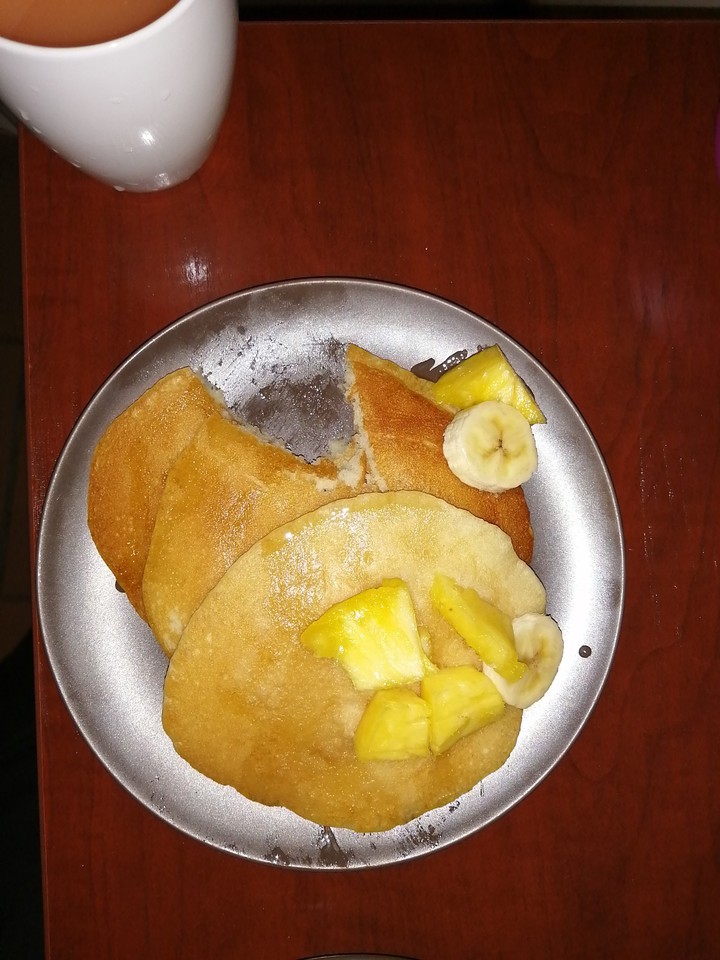 pancake with banana, honey, and pineapple
