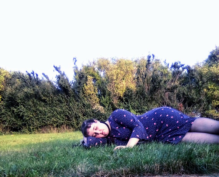Woman Sleeping On The Grass